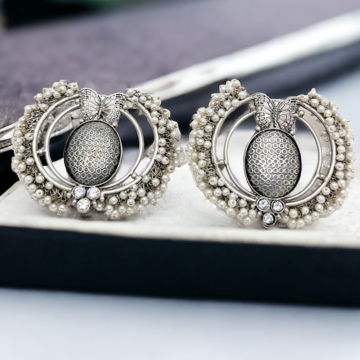 Exclusive silver replica earring